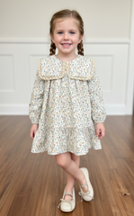 VESTIDO DE NIÑA CON CUELLO PETER PAN FLORAL SUELTAS