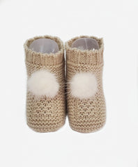 Baby booties with pom poms