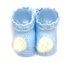 Baby booties with pom poms